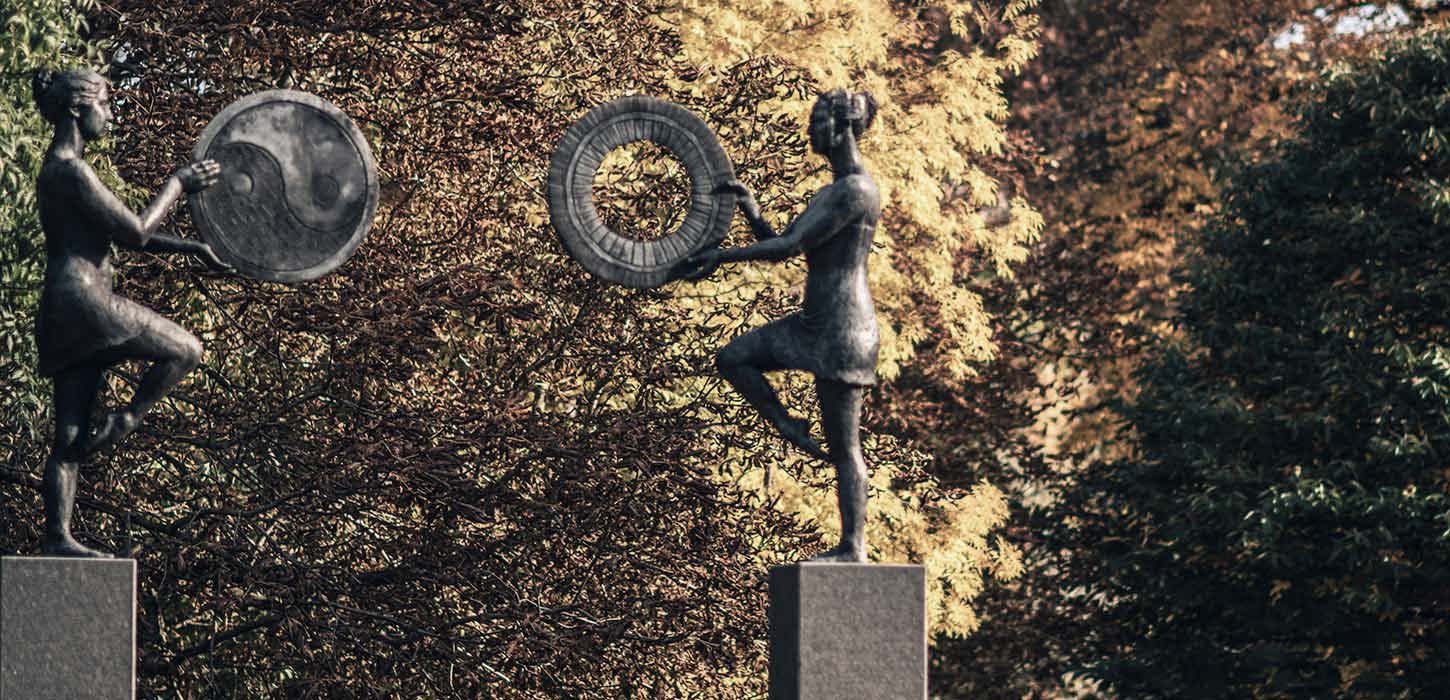 Sculpture "Balance Arc" with autumn leaves
