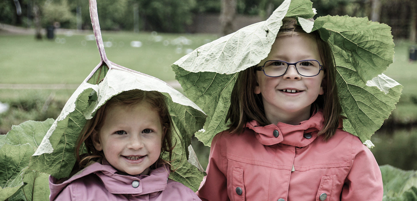 Girls with dock leaves