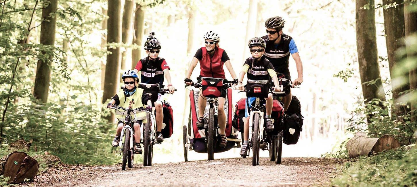 Family cycling in the woods