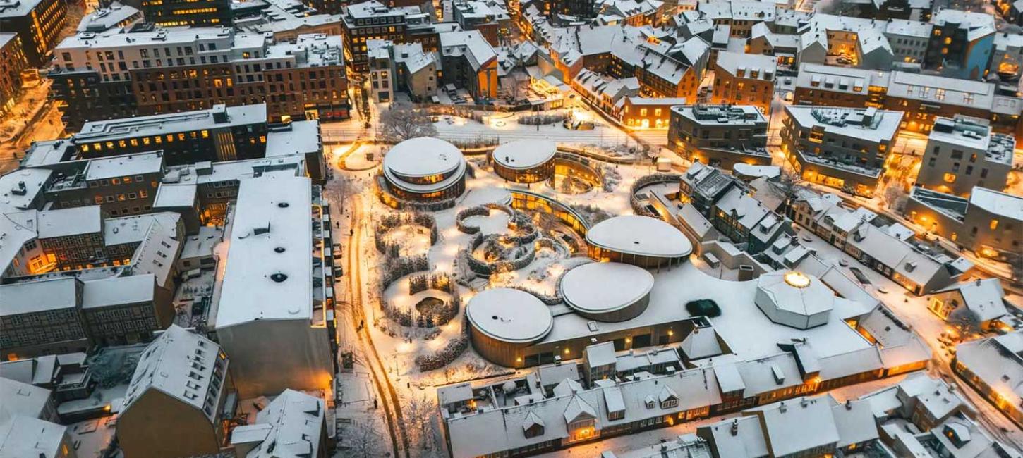 The old quarter with lights and snow