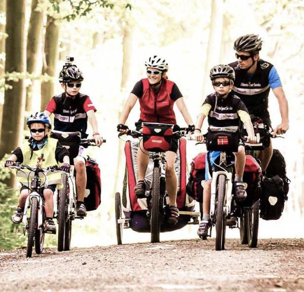 Family cycling in the woods