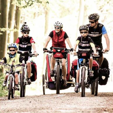Family cycling in the woods