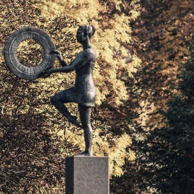 Sculpture "Balance Arc" with autumn leaves