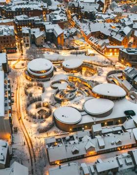 The old quarter with lights and snow